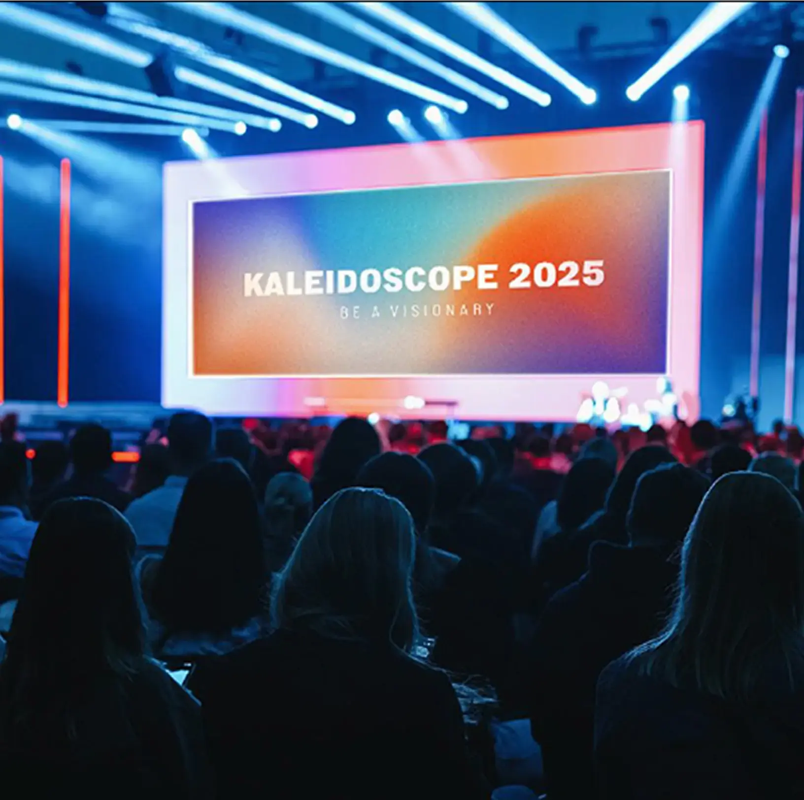 A full audience watching a presentation at the Kaleidoscope conference.